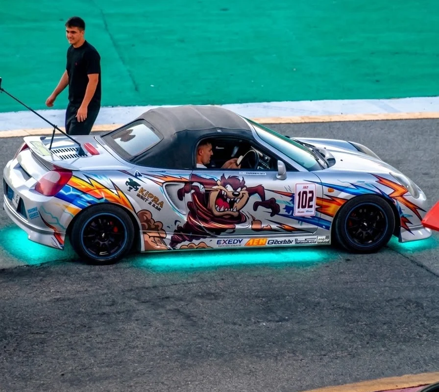 Tazzmobil side-on: a silver MR2 Spyder with its hand-drawn livery and number 102. Photo: Don Mayor